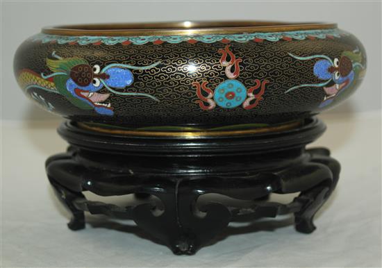 A Chinese cloisonne enamel dragon shallow bowl, Ming mark, early 20th century, diam.20.5cm, ebonised wood stand